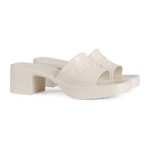 GUCCI Plastique logo-embossed rubber mules in Mystic White